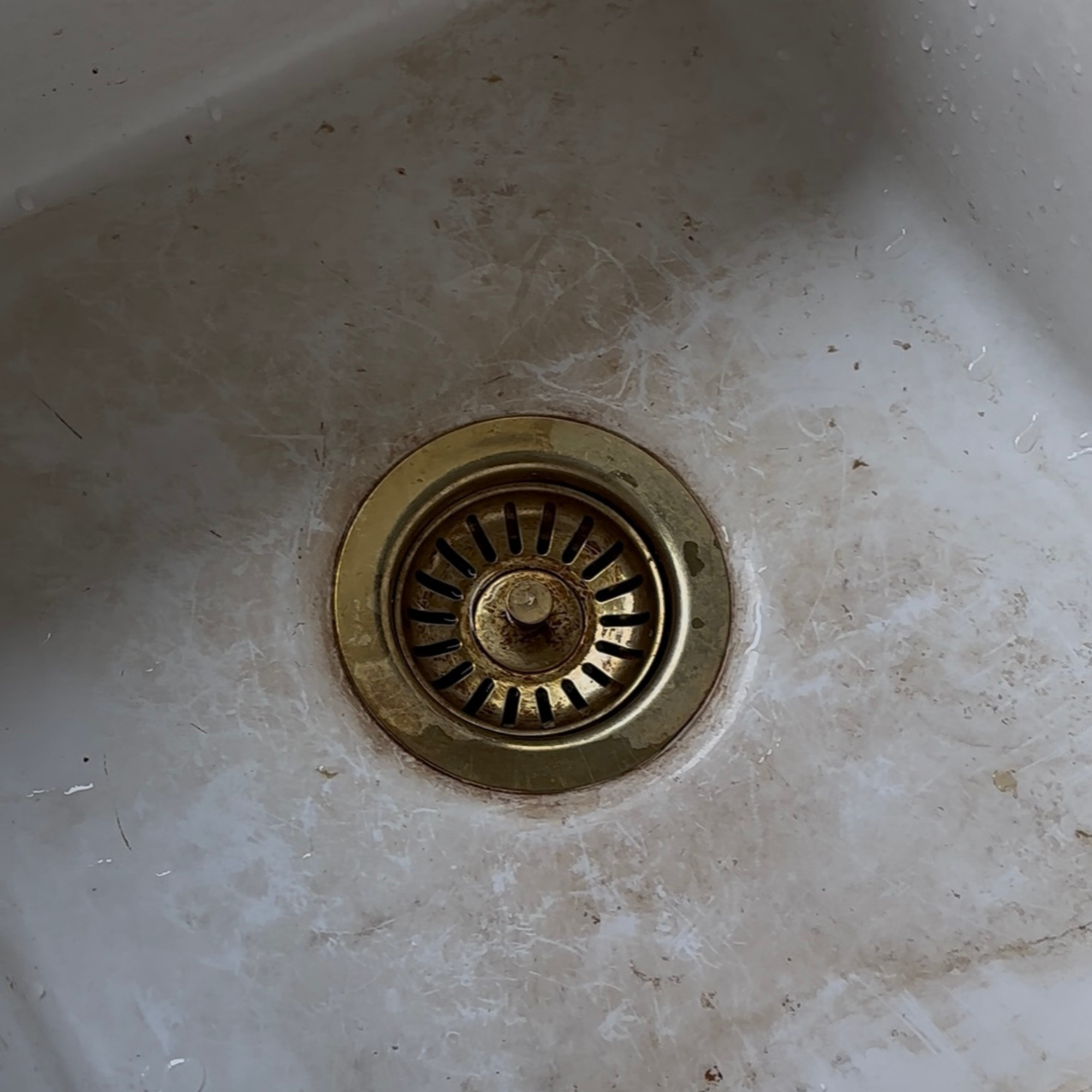Heather's sink before using Bar Keepers Friend. the bottom has brown stains.