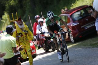Didi The Devil runs next to Robert Gesink during the 2013 Tour de France
