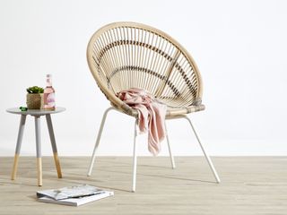 rattan outdoor dining chair in a rounded boho style