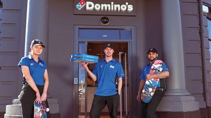 Dominos Pizza employees with skateboards 