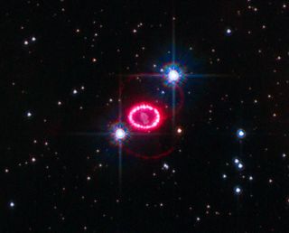 A satellite image shows the ring-like remnants of supernova 1987A, the closest supernova to Earth in the past 400 years.