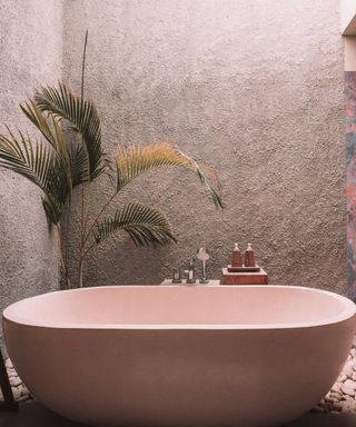 Spa Bathroom with blush bath and marble wall