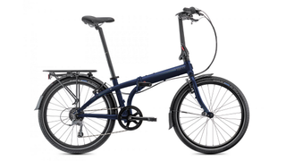 A Tern Node D8 folding bike in dark blue with mudguards and luggage rack against a white background