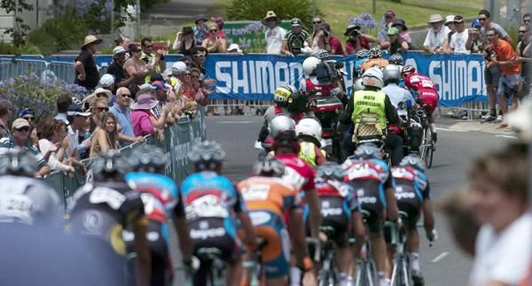 The lead group look around for the chasers among race motos in the home straight with a lap to go.
