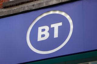 BT logo in white typeface on a BT-purple background - a sign above a shopfront