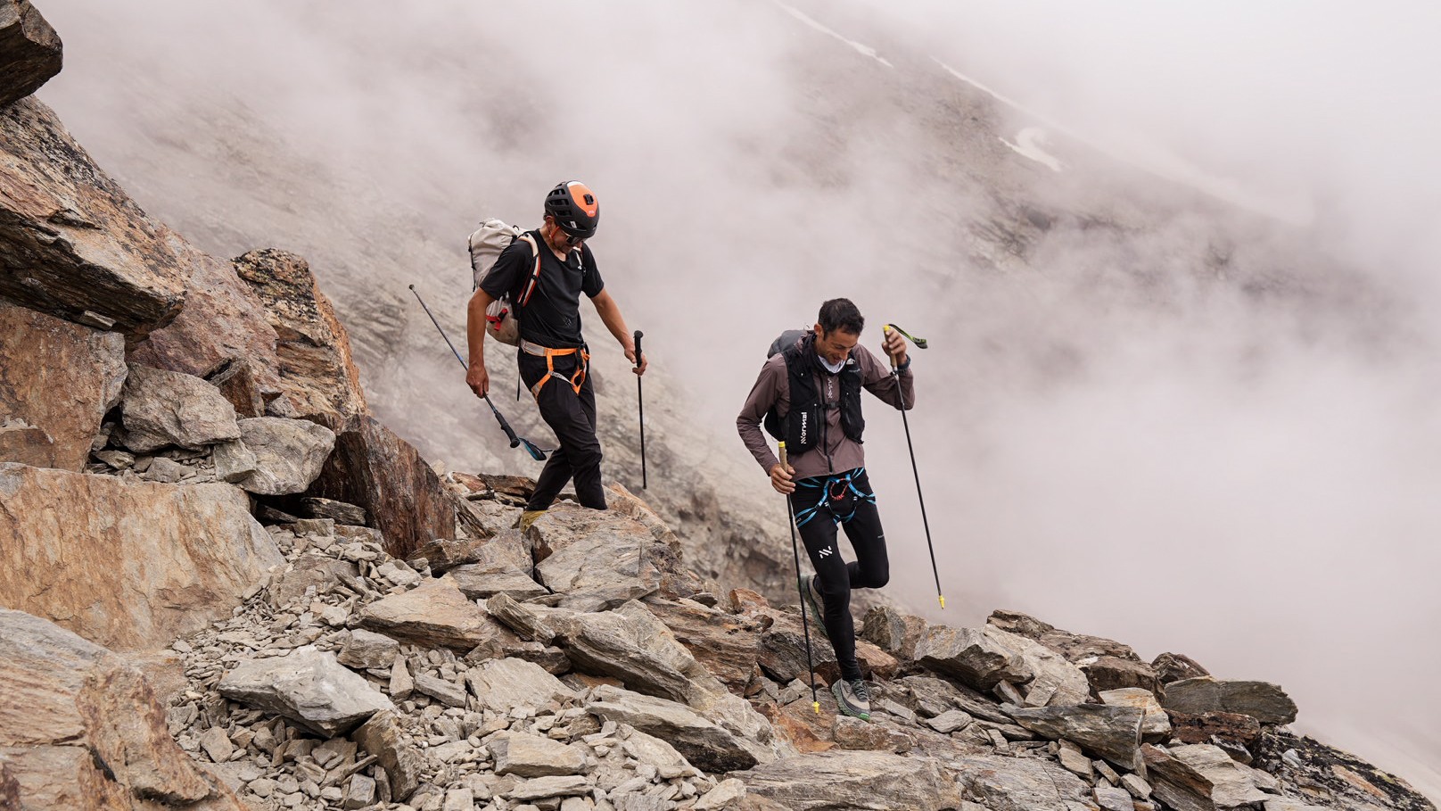 Kilian Jornet and another runner navigating the mountains