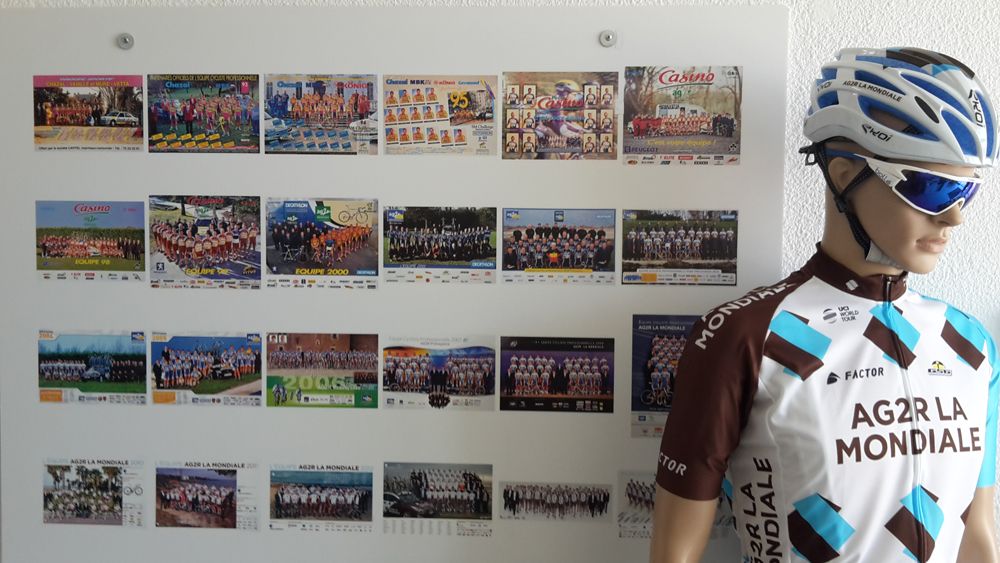 A full-kit mannequin stands by a photo-history of the team in the reception area