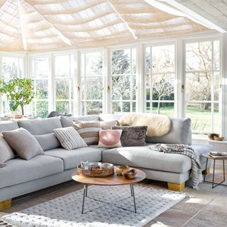 Grey sofa in conservatory