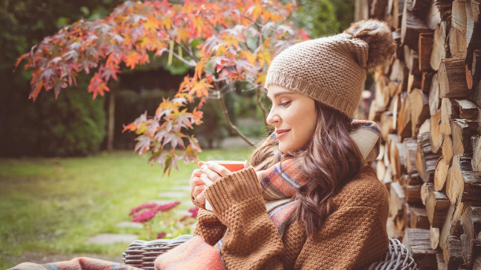 Woman relaxing in fall garden