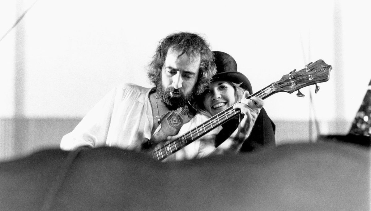 Singer Stevie Nicks and bass player John McVie of the rock group &quot;Fleetwood Mac&quot; perform onstage in May 1977 in Oakland, California