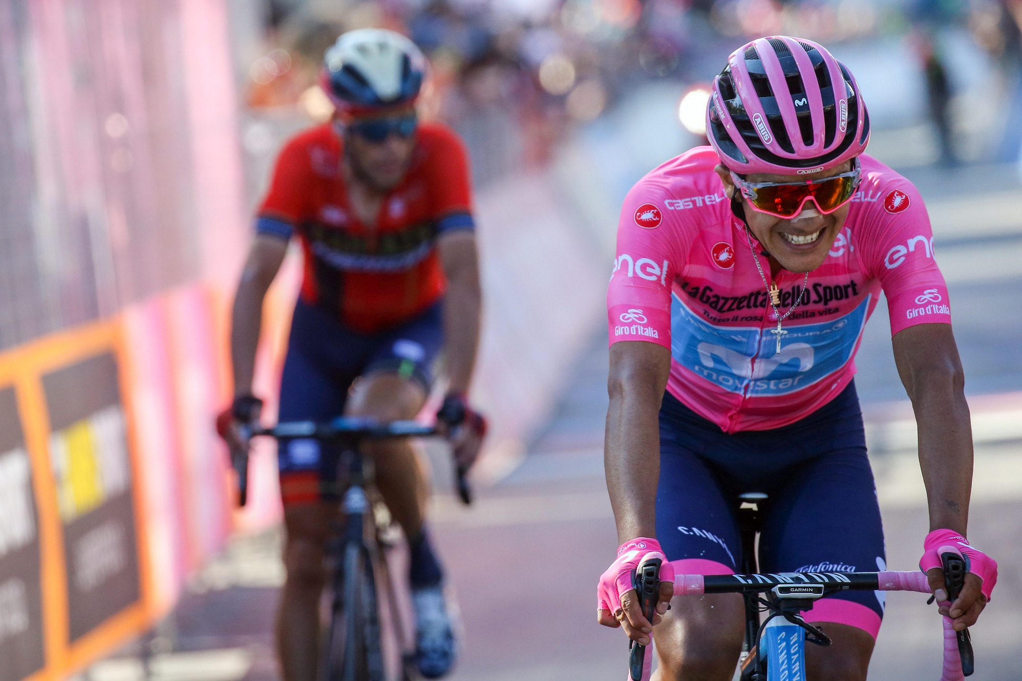 Carapaz grimaces as he crosses the line ahead of Nibali