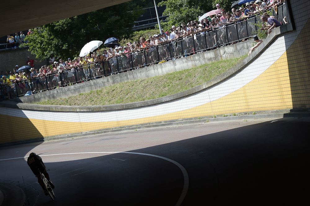 Supporters look at Belgium's Stijn Devolder competing in a 13.8 km individual time-trial, the first stage of the 102nd edition of the Tour de France cycling race on July 4, 2015, in Utrecht, The Netherlands