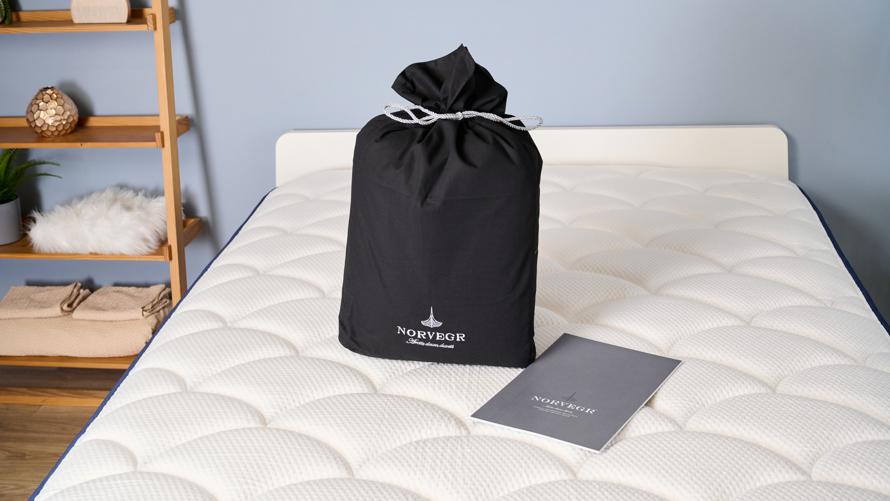 The Norvegr European White Goose 100% Down Firm Pillow on the bed