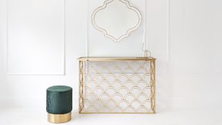 gold decorative radiator cover and console table