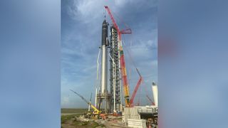 SpaceX's first orbital Starship SN20 is stacked atop its massive Super Heavy Booster 4 for the first time on Aug. 6, 2021 at the company's Starbase facility near Boca Chica Village in South Texas. They stood 395 feet tall, taller than NASA's Saturn V moon rocket.
