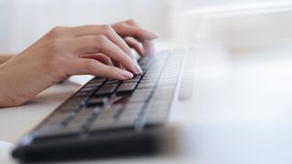 Best keyboard for home office: image shows hands above keyboard