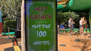 Signage outside the relatively short 100-minute wait to meet the Grinch at Grinchmas 2025 Universal Islands of Adventure.