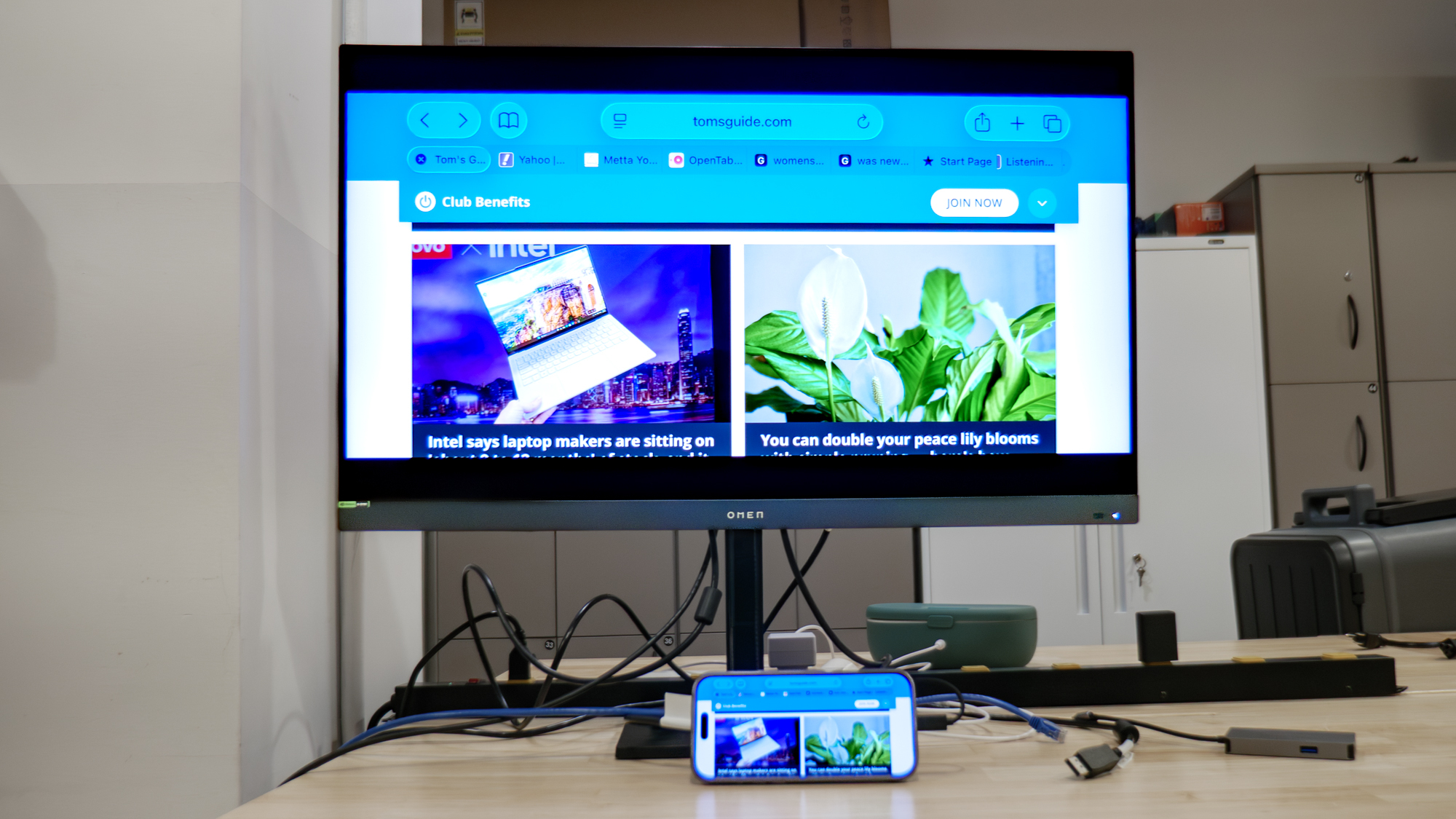 Satechi OntheGo 7-in-1 Multiport Adapter connected to iPhone and monitor.