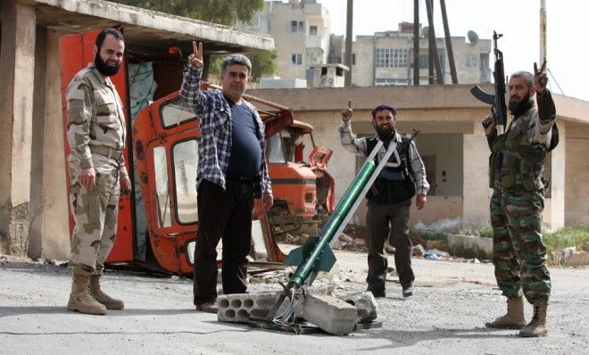 Syrian fighters test out a new rocket in Aleppo on April 1. 