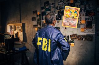 An FBI agent stares at a Pokemon card.