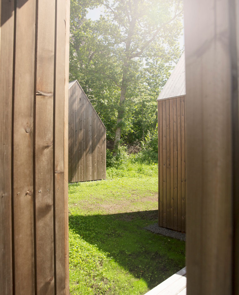 Sneak a peek between two cabin huts