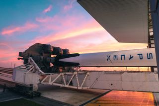A SpaceX Falcon 9 rocket carrying the company's first Crew Dragon spacecraft rolls out of its hangar at Launch Pad 39A of NASA's Kennedy Space Center in Cape Canaveral, Florida on Jan. 3, 2018.