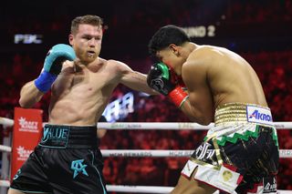  Canelo Alvarez throws a left against Jaime Munguia in their super middleweight championship title fight at T-Mobile Arena on May 04, 2024 