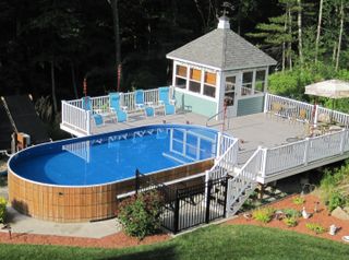 above ground pool with decking and pavilion
