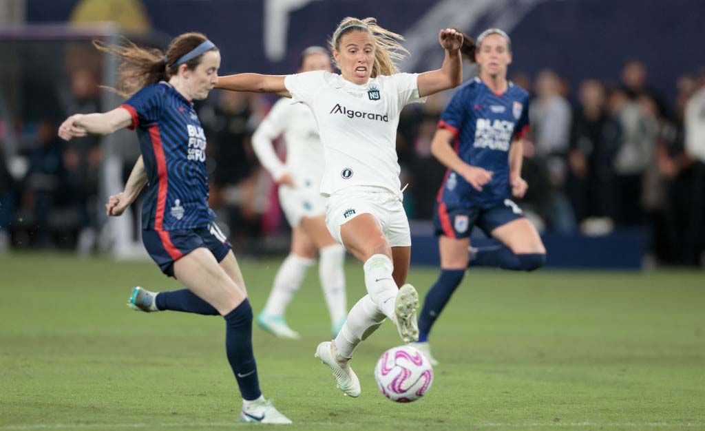 Maitane Lopez #77 of Gotham FC defending against Rose Lavelle #16 of OL Reign during NWSL Cup Final game between NJ/NY Gotham City FC and OL Reign at Snapdragon Stadium on November 11, 2023 in San Diego, California