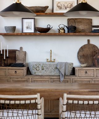 Rustic kitchen in wood with contemporary accessories and stone basin