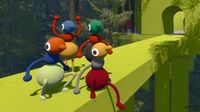 Four players on a bridge, one holding up arms, others sitting or crouching