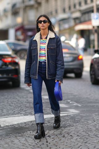a street style influencer wearing turn-up straight leg jeans