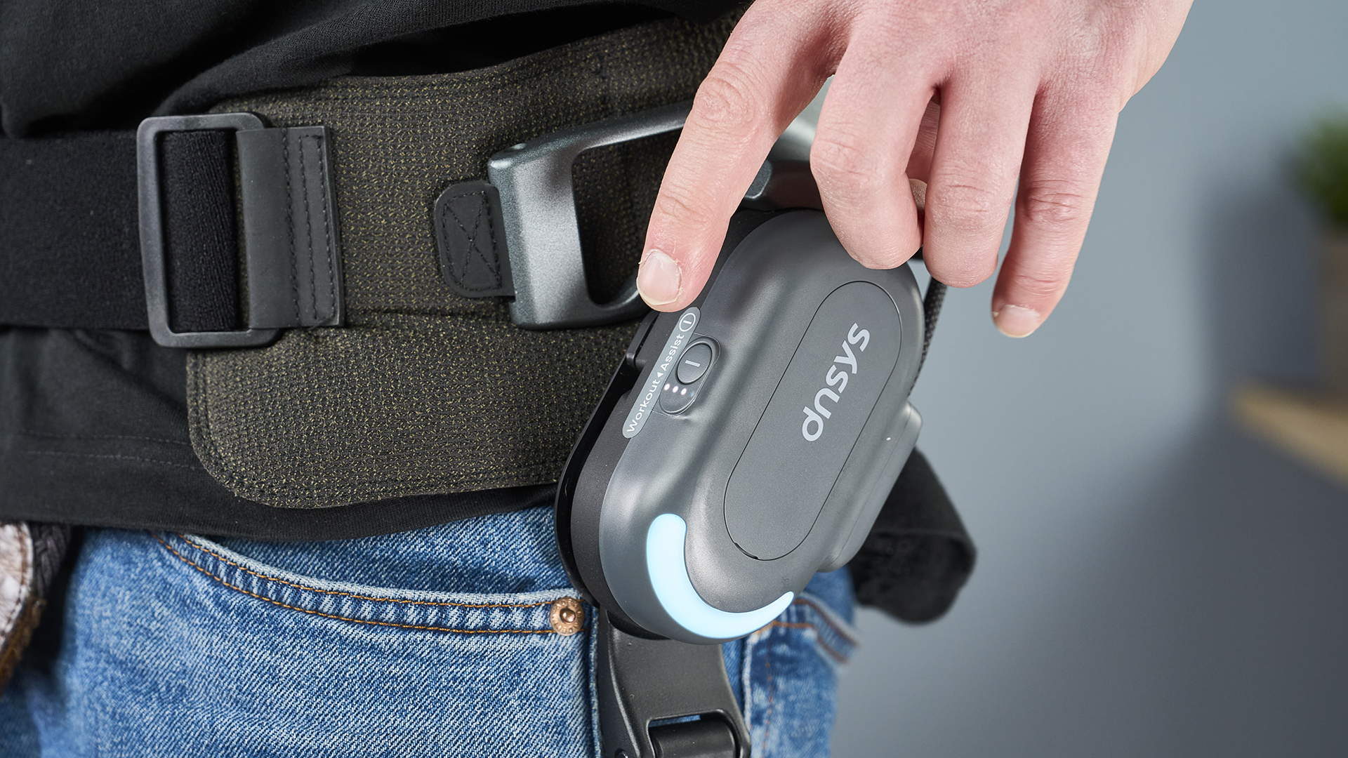 The Dnsys X1 Exoskeleton having its onboard control button pressed