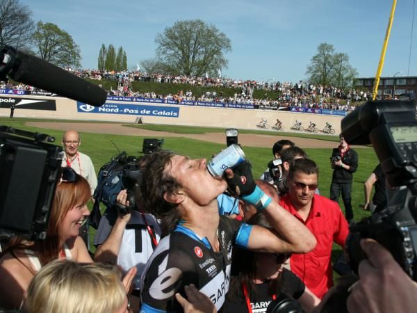 Johan Van Summeren (Garmin-Cerv&eacute;lo) enjoys a cold beverage after his win at Paris-Roubaix.