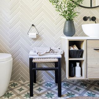 Neutral bathroom with tiled walls and floor