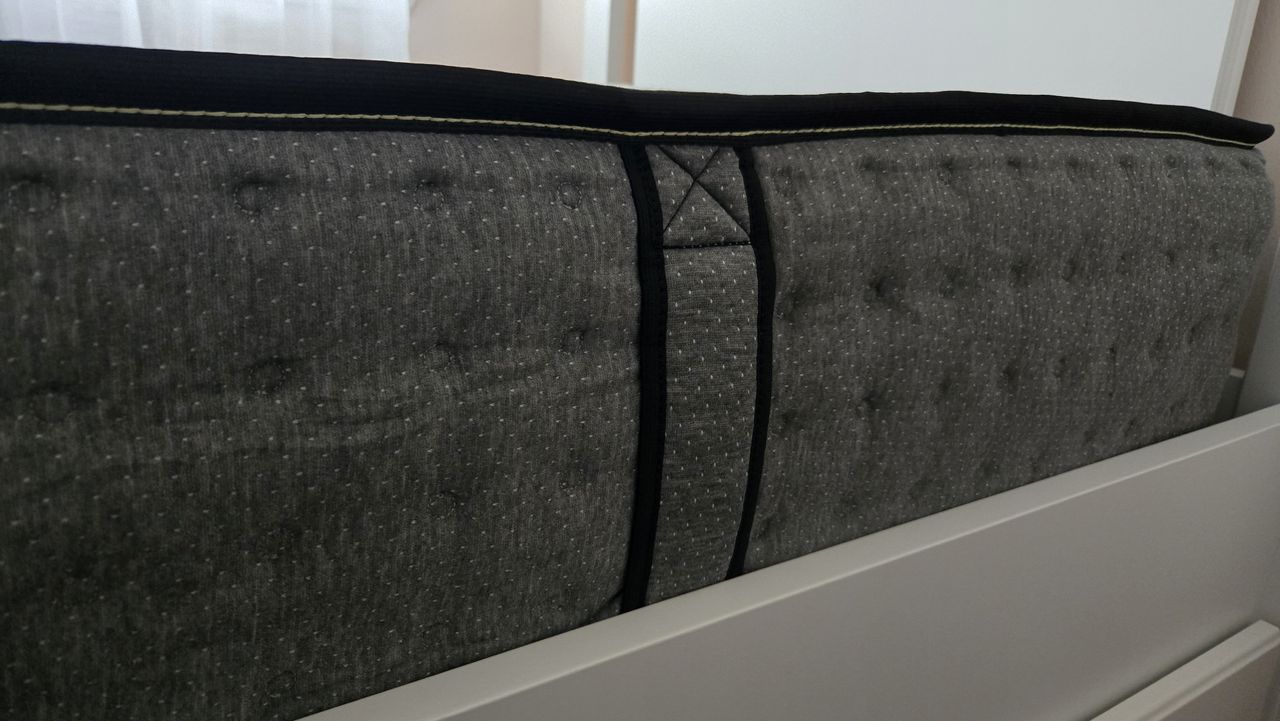The edge of the Siena Premier Hybrid Mattress, which contains side carry handles