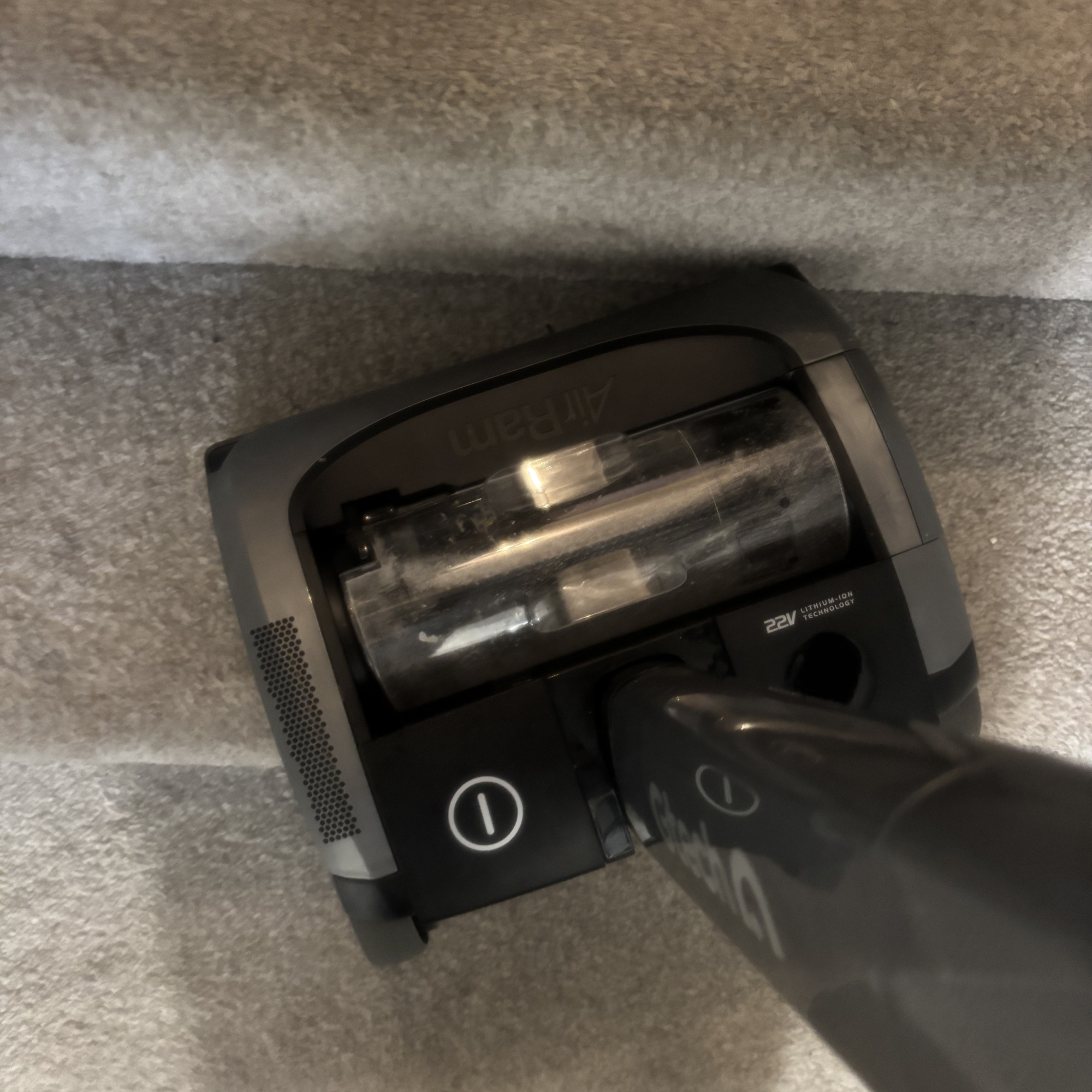 AirRAM 2 Core Cordless Vacuum on carpeted stairs