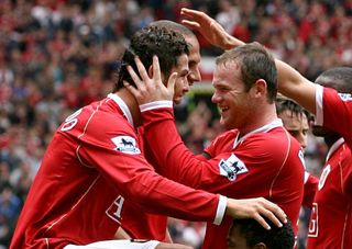 Cristiano Ronaldo (left) and Wayne Rooney (right) played together at Manchester United from 2004 to 2009 (Peter Byrne/PA).