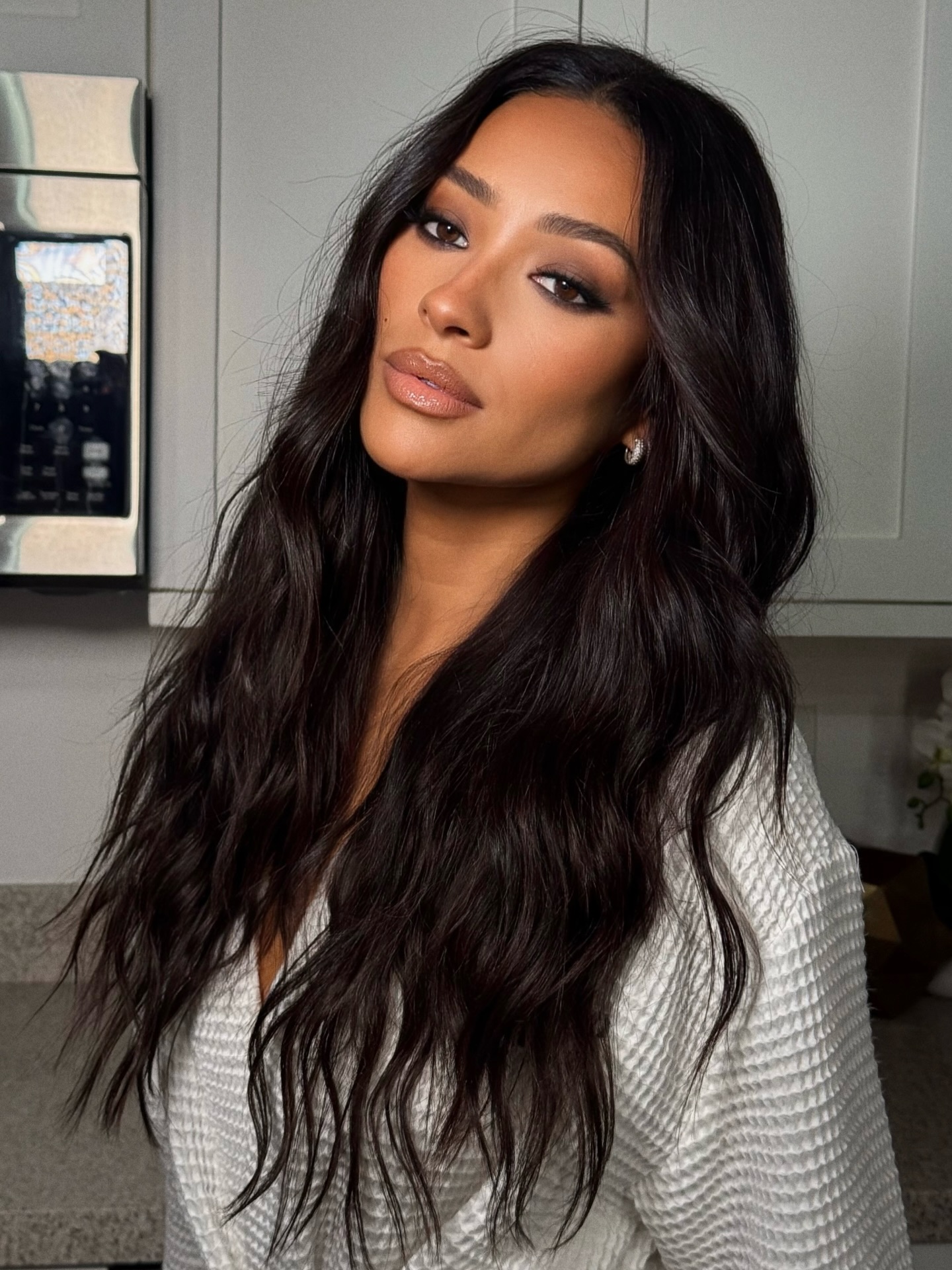 An image of Shay Mitchell with beachy waves by Justine Marjan.