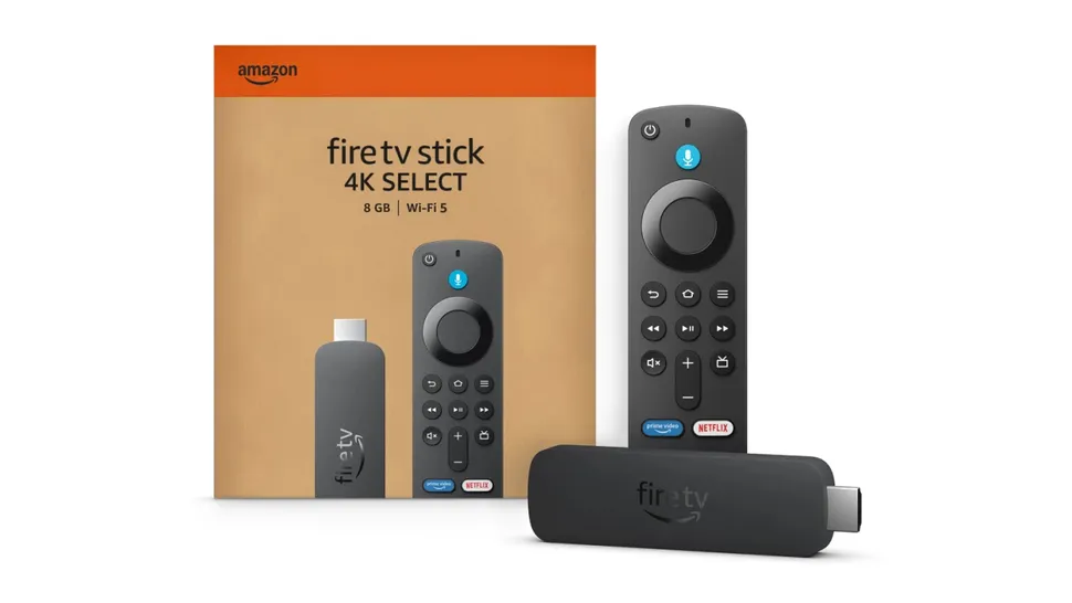 The Amazon Fire TV Stick 4K Select lying next to its box with its remote standing upright, on a white background.