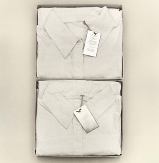 White shirts folded in boxes