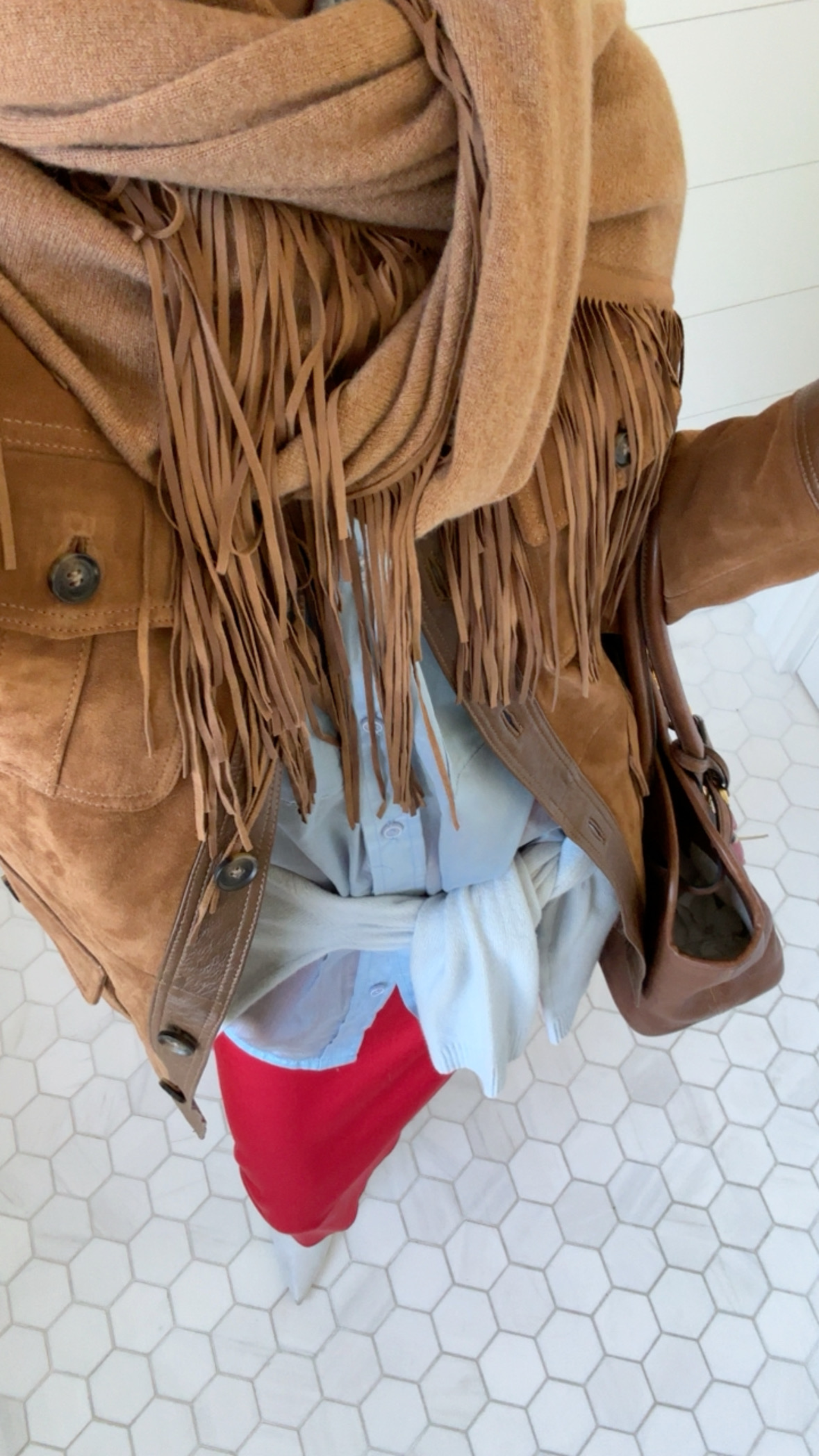 Larissa Mills wearing a knit scarf around her neck