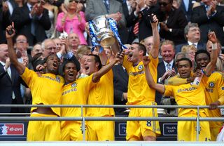 Frank Lampard, third right, lifts the trophy in 2009 after firing Chelsea's winner against Everton