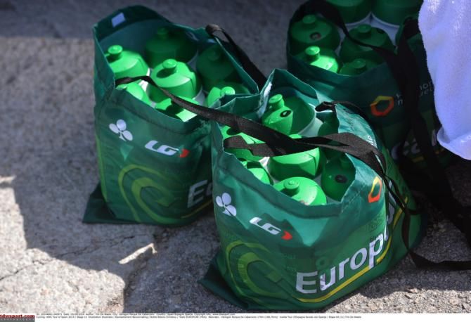 Europcar soigneurs getting bidons ready for the riders