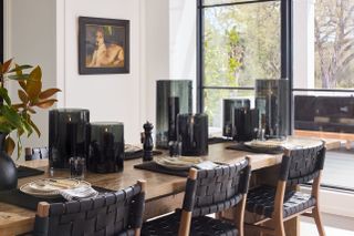 a wooden dining table with black decor