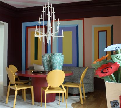 A living room with faux rainbow paneling on the walls