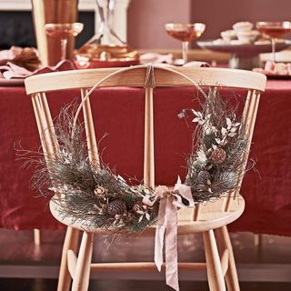 wooden chair with dried flower wreath