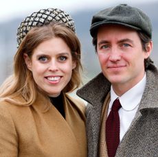 Princess Beatrice and Edoardo Mapelli Mozzi smiling at the camera and wearing wool coats