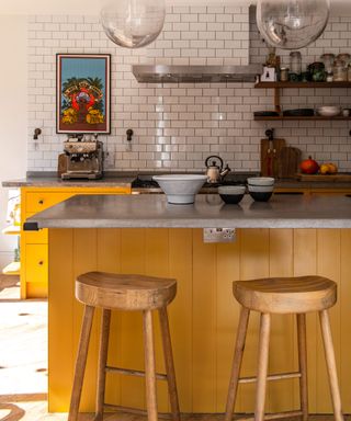 Cheerful kitchen with yellow cabinets and island