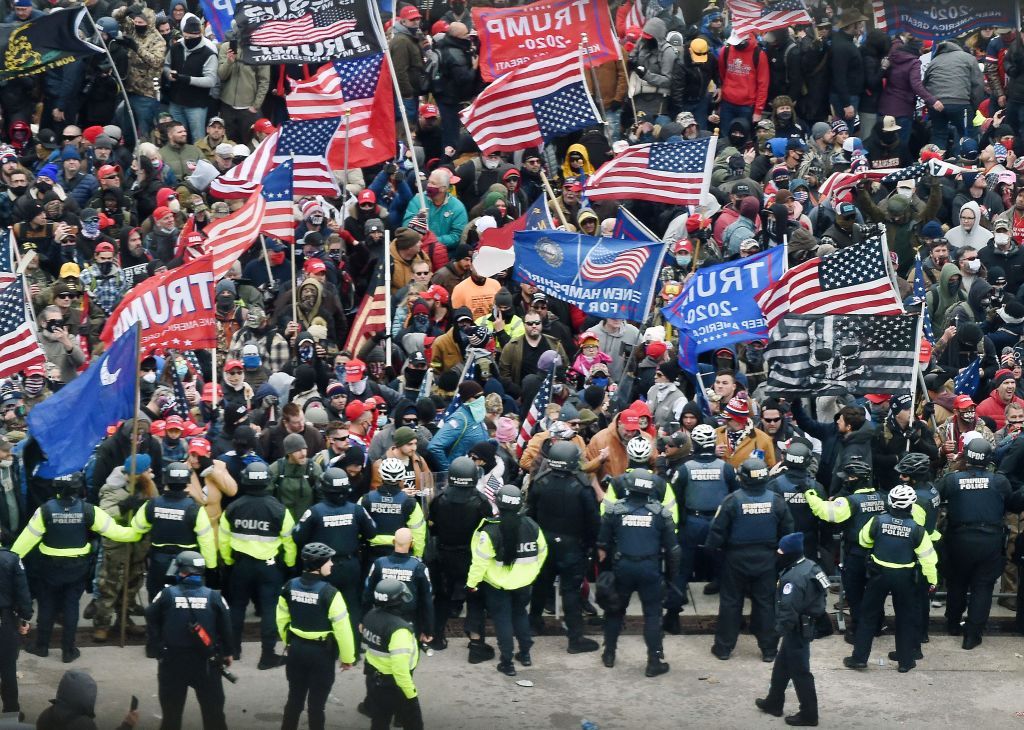 Trump supporters face off with police at the Capitol.